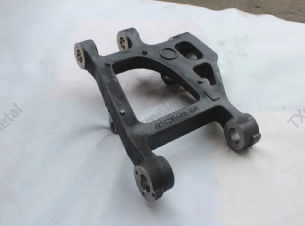Ductile iron cast suspension bracket for automotive chassis and suspension system.