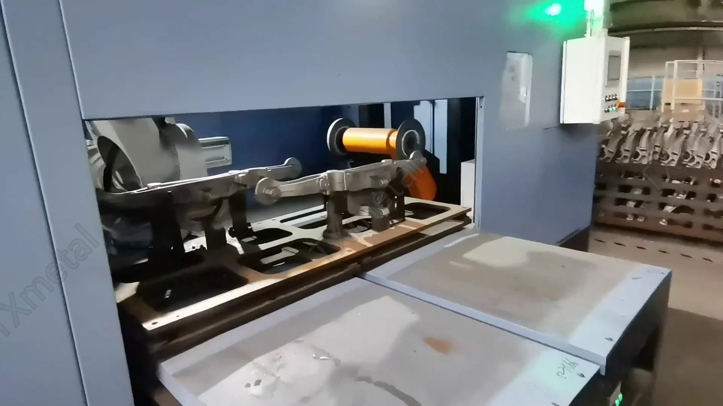 Close-up of casting bracket clamped in CNC machining fixture for precision cutting at TXmetal factory.