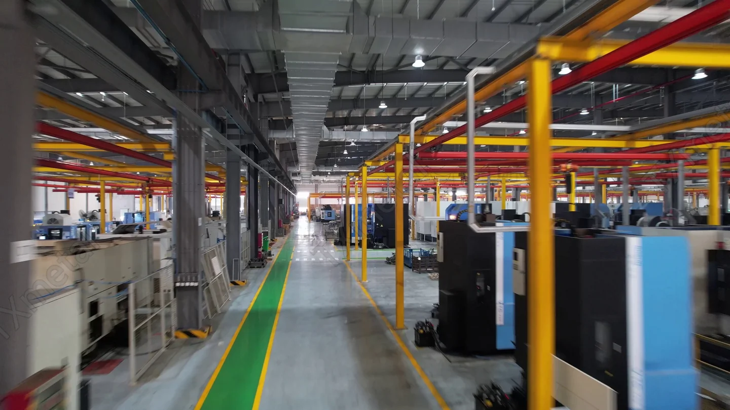 Wide view of CNC machining workshop with multiple machining centers at TXmetal factory.