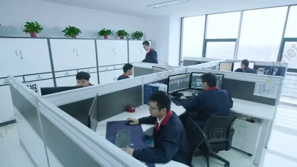 This image shows professional foundry engineers working at their desks with dual monitors, focusing on casting design and data analysis. In a modern foundry, engineering teams utilize CAD and CAE software to design and optimize the production of gray iron, ductile iron, and austempered ductile iron (ADI) castings. These processes ensure precision, efficiency, and reliability in manufacturing, supporting industries such as automotive, machinery, and heavy equipment.