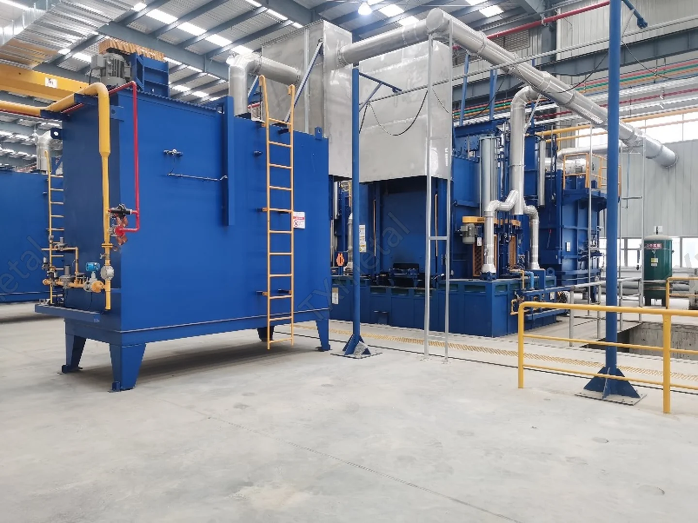 Industrial heat treatment furnace for processing gray iron, ductile iron, and ADI castings in a foundry.