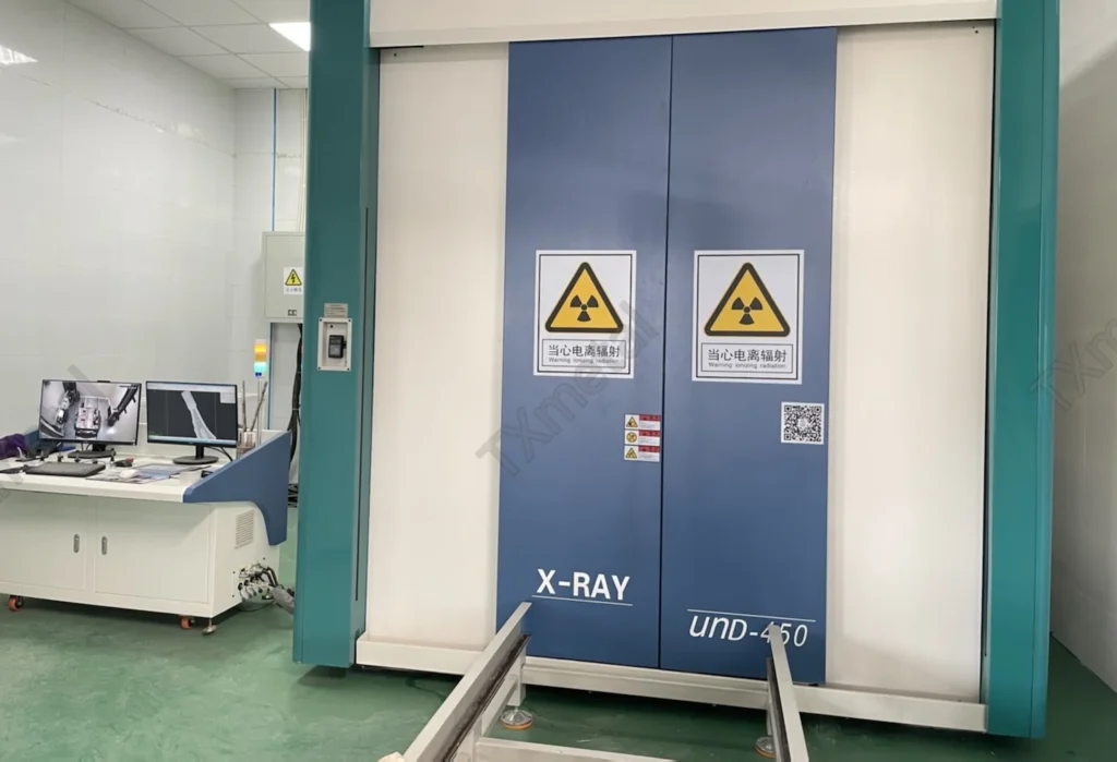 X-ray NDT inspection cabinet for gray iron, ductile iron, and ADI castings in a foundry, ensuring high-quality defect-free production.