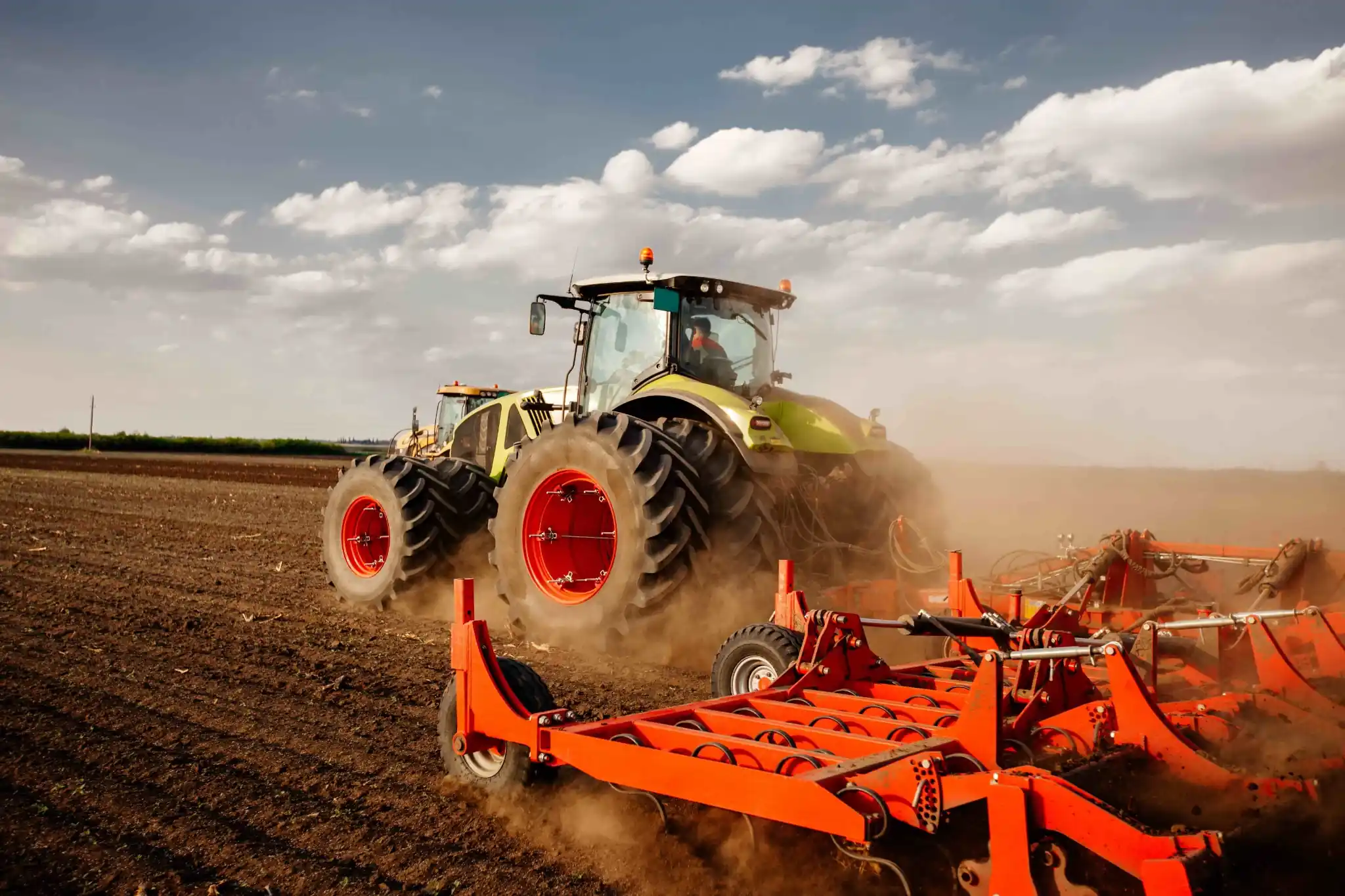 Agricultural tractor and soil tillage equipment using iron casting parts such as housings, brackets, and transmission components from TXmetal.
